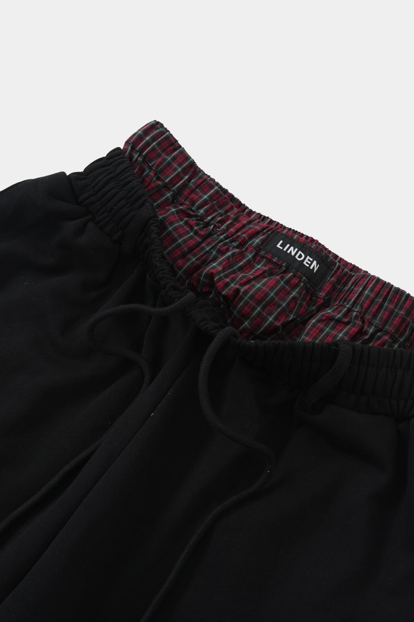 Itim na pantalon na may dalawang baywang