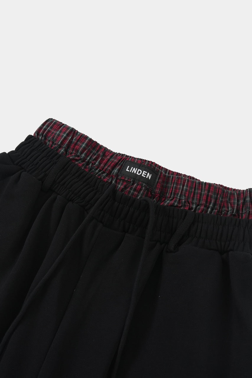 Itim na pantalon na may dalawang baywang